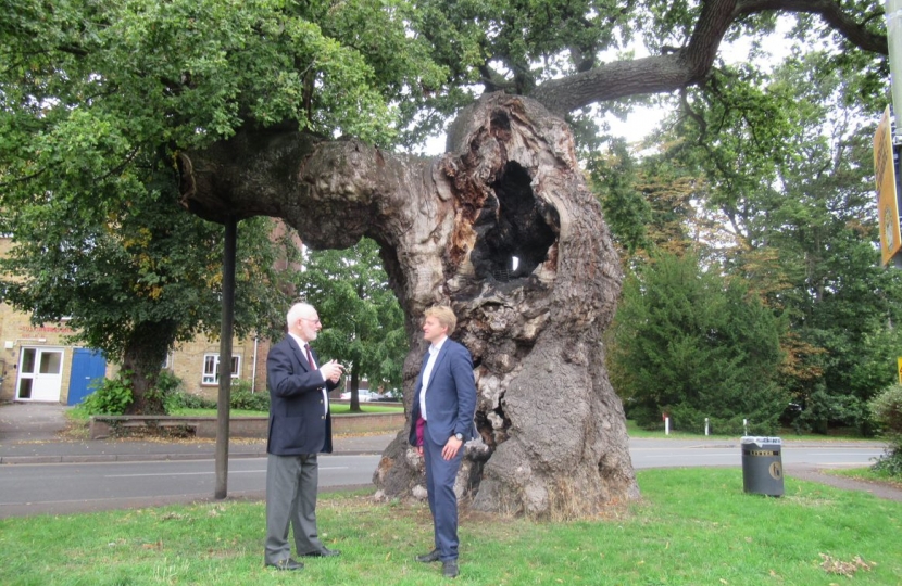Dr Ben Spencer MP and Mr Ian Mawson, Chairman, Addlestone Historical Society, by the Crouch Oak, Addlestone