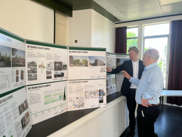 Dr Ben Spencer viewing plans for the new Weybridge health facilities