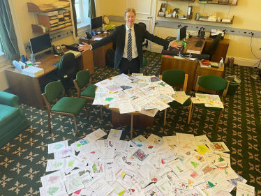 Dr Ben Spencer MP with previous Christmas card competition entries